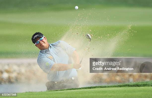 Kiradech Aphibarnrat of Thailand plays from a bunker on the 6th hole during the final round of the Abu Dhabi HSBC Championship at Abu Dhabi Golf Club...