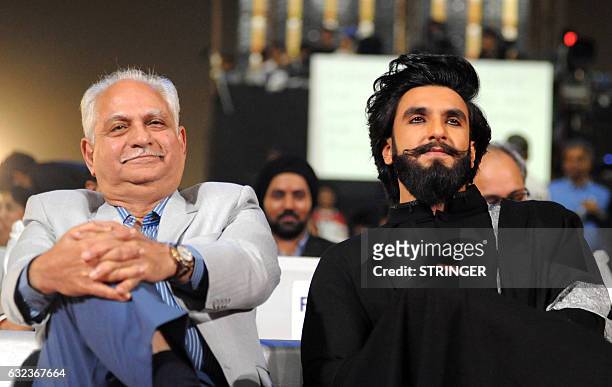 Indian Bollywood film director - producer Ramesh Sippy and actor Ranveer Singh attend the 'Umang Mumbai Police Show 2017 in Mumbai on January 21,...