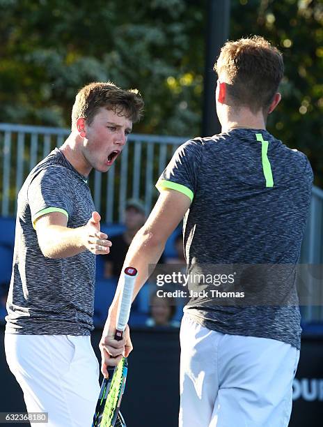 Simon Carr of Ireland and Max Stewart of Great Britain compete in their first round match against Dan Added of France and Matteo Martineau of France...