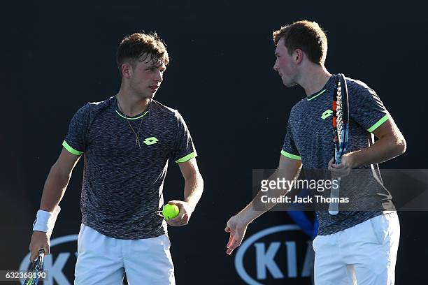 Simon Carr of Ireland and Max Stewart of Great Britain compete in their first round match against Dan Added of France and Matteo Martineau of France...