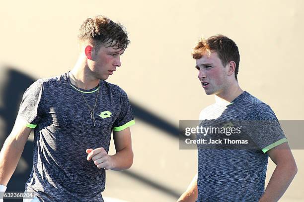 Simon Carr of Ireland and Max Stewart of Great Britain compete in their first round match against Dan Added of France and Matteo Martineau of France...