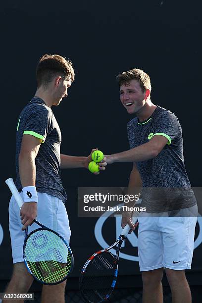 Simon Carr of Ireland and Max Stewart of Great Britain compete in their first round match against Dan Added of France and Matteo Martineau of France...