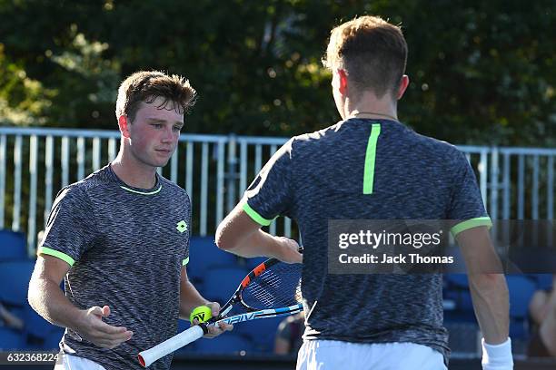 Simon Carr of Ireland and Max Stewart of Great Britain compete in their first round match against Dan Added of France and Matteo Martineau of France...