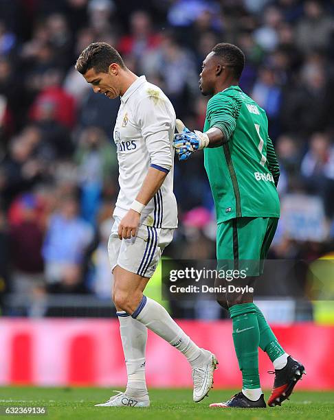 Cristiano Ronaldo of Real Madrid is consoled by Carlos Idriss Kameni of Malaga CF during the La Liga match between Real Madrid CF and Malaga CF at...