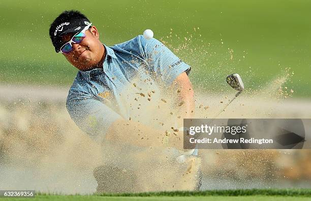 Kiradech Aphibarnrat of Thailand plays from a bunker on the 6th hole during the final round of the Abu Dhabi HSBC Championship at Abu Dhabi Golf Club...