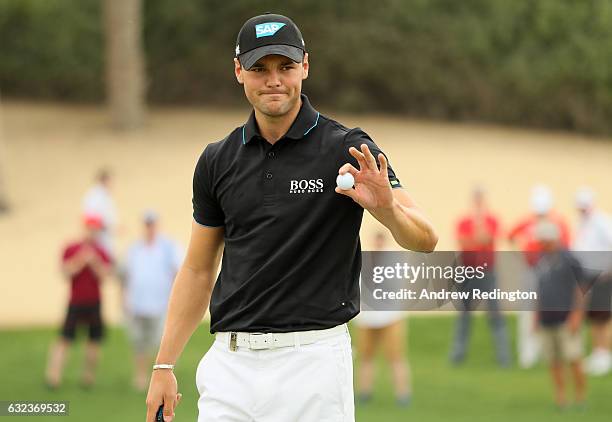 Martin Kaymer of Germany acknowledges his birdie on the 8th hole during the final round of the Abu Dhabi HSBC Championship at Abu Dhabi Golf Club on...
