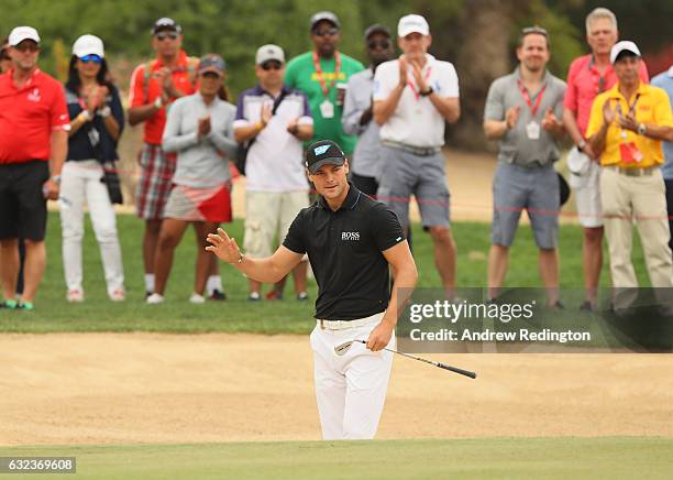 Martin Kaymer of Germany acknowledges the crowd on the 8th hole during the final round of the Abu Dhabi HSBC Championship at Abu Dhabi Golf Club on...