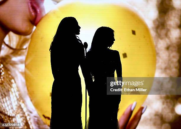 Adult film actresses Ariana Marie and Kat Dior are silhouetted on stage as they present an award during the 2017 Adult Video News Awards at The Joint...