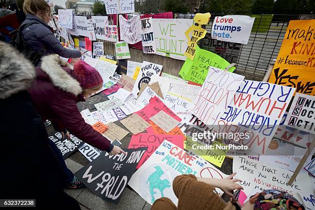Thousands of protest signs are left behind by protestors at the gates surrounding the White House, after hundred-thousands participated in the Womens...