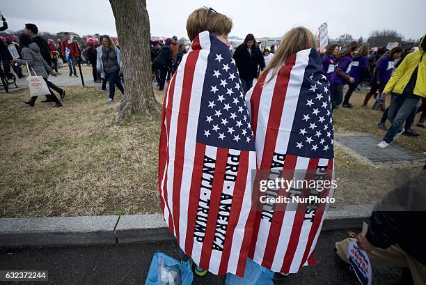 Protestors gather on the lawns the White house in Washington DC, on Jan. 21 during the Womens March on Washington, a day after the inauguration of...