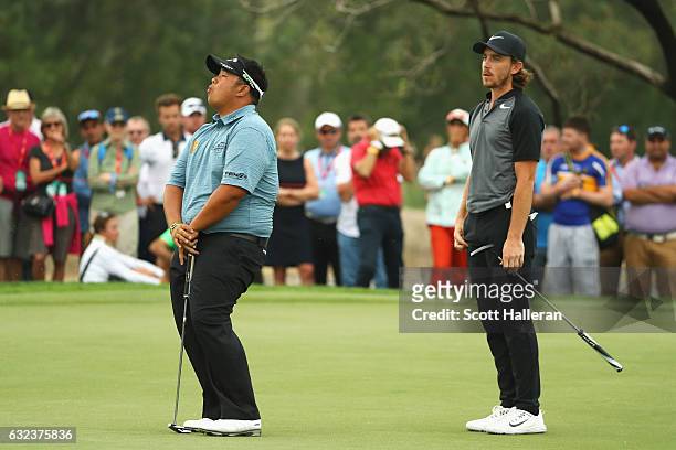 Kiradech Aphibarnrat of Thailand reacts after missing his birdie putt on the 16th green during the final round of the Abu Dhabi HSBC Championship at...