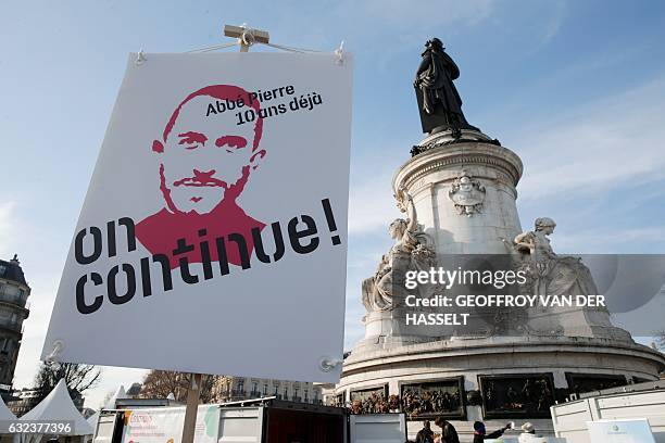 Picture shows a poster at the Place de la Republique during an event marking the 10th anniversary of the death of Abbe Pierre, founder of the Emmaus...