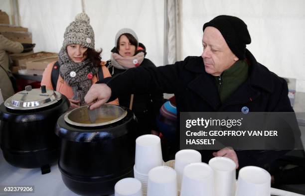 French chef Thierry Marx serves soup during an event marking the 10th anniversary of the death of Abbe Pierre, founder of the Emmaus solidarity...