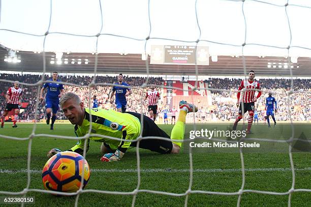 Kasper Schmeichel of Leicester City reacts as Dusan Tadic of Southampton converts the penalty to score his team's third goal during the Premier...