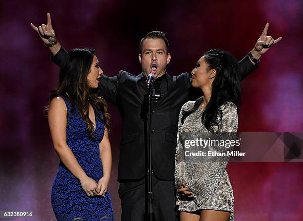 Adult film actress Eva Lovia, adult film actor Chad White and adult film actress/director Asa Akira present an award during the 2017 Adult Video News...
