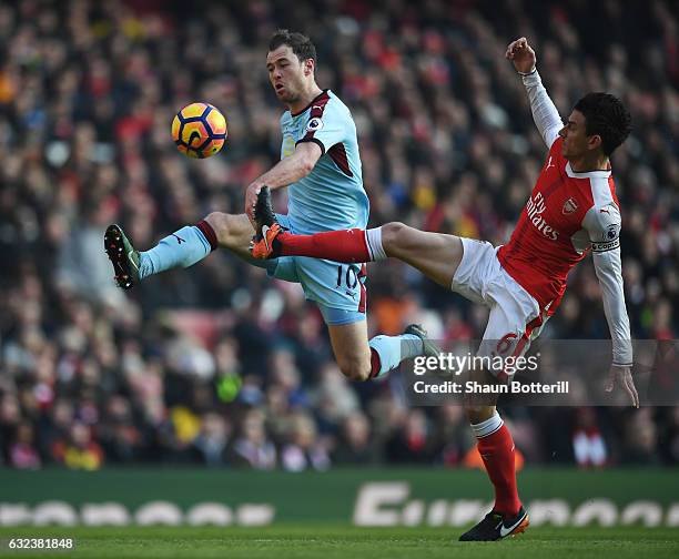 Ashley Barnes of Burnley and Laurent Koscielny of Arsenal compete for the ball during the Premier League match between Arsenal and Burnley at the...