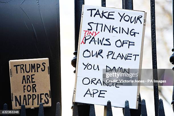 Protest banners are left in Duncannon Street, London, following a march on Saturday to promote women's rights in the wake of the US election result,...