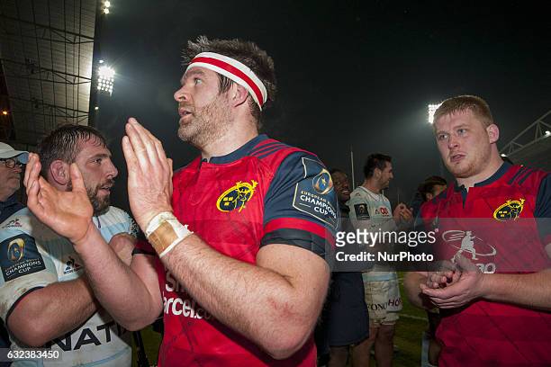Billy Holland and John Ryan of Munster celebrate after the European Rugby Champions Cup Round 6 match between Munster Rugby and Racing 92 at Thomond...