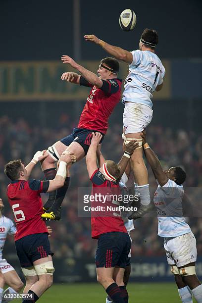 Donnacha Ryan of Munster fights for the ball with Manuel Carizza of Racing during the European Rugby Champions Cup Round 6 match between Munster...
