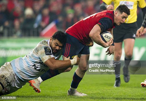 Ronan O'Mahony of Munster tackled by So'otala Fa'aso'o of Racing during the European Rugby Champions Cup Round 6 match between Munster Rugby and...