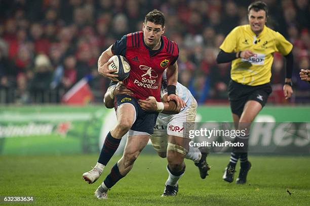 Ronan O'Mahony of Munster runs with the ball during the European Rugby Champions Cup Round 6 match between Munster Rugby and Racing 92 at Thomond...