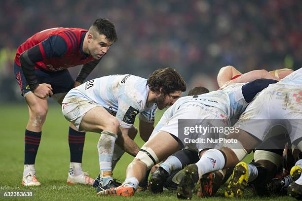 Conor Murray of Munster looks at Maxime Machenaud of Racing during the European Rugby Champions Cup Round 6 match between Munster Rugby and Racing 92...