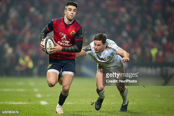 Conor Murray of Munster runs with the ball during the European Rugby Champions Cup Round 6 match between Munster Rugby and Racing 92 at Thomond Park...