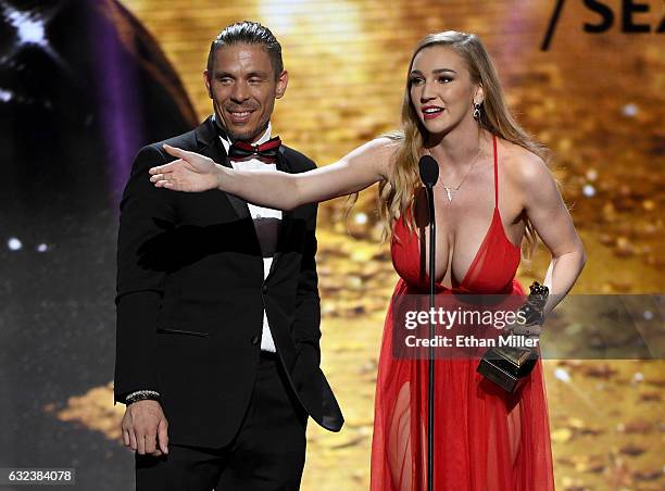 Adult film actor/director Mick Blue and adult film actress Kendra Sunderland accept the award for Best Boy/Girl Sex Scene during the 2017 Adult Video...