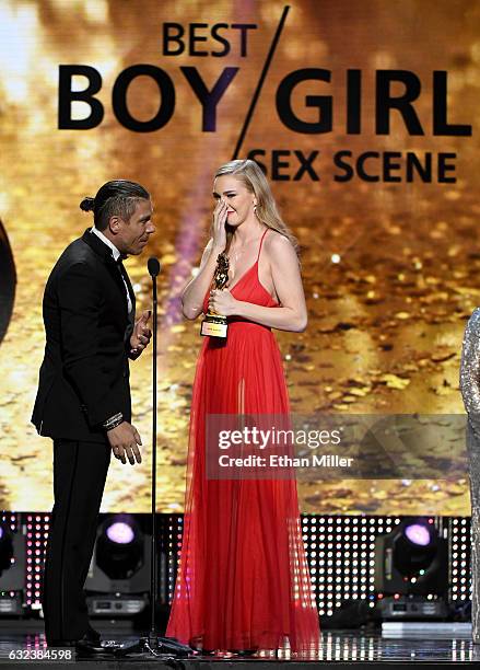 Adult film actor/director Mick Blue and adult film actress Kendra Sunderland accept the award for Best Boy/Girl Sex Scene during the 2017 Adult Video...