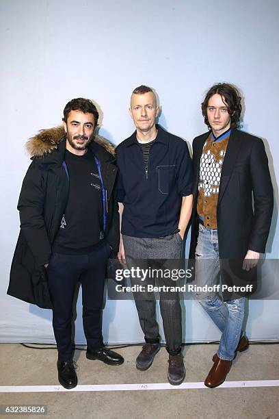 Stylist of 'Lanvin Men', Lucas Ossendrijver standing between actor Cesar Domboy and his Manager, Producer Benoit Ponsaille attend the Lanvin Menswear...