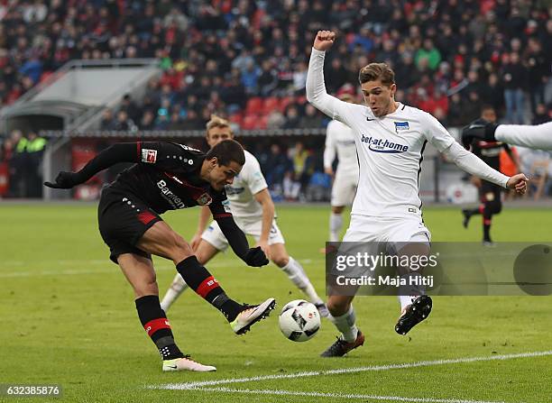 Javier Hernandez of Leverkusen is challenged by Niklas Stark of Berlin during the Bundesliga match between Bayer 04 Leverkusen and Hertha BSC at...