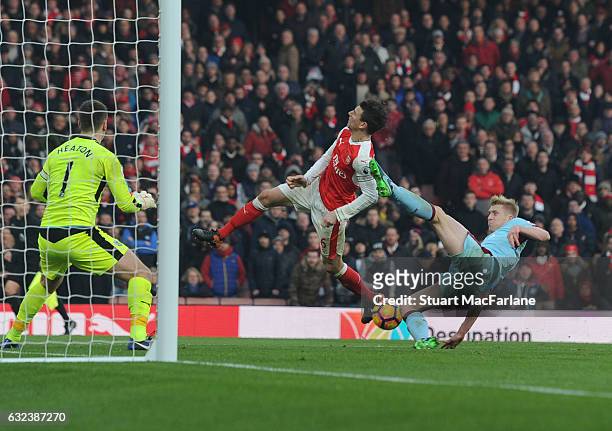 Laurent Koscielny is kicked in the face by Burnley defender Ben Mee for the Arsenal penalty during the Premier League match between Arsenal and...