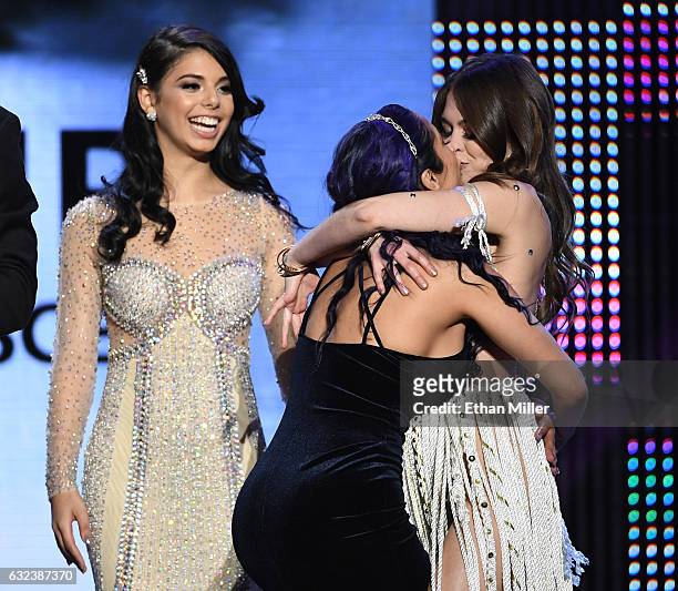 Adult film actress and trophy girl Gina Valentina looks on as adult film actress Reena Sky and adult film actress and co-host Riley Reid kiss as they...