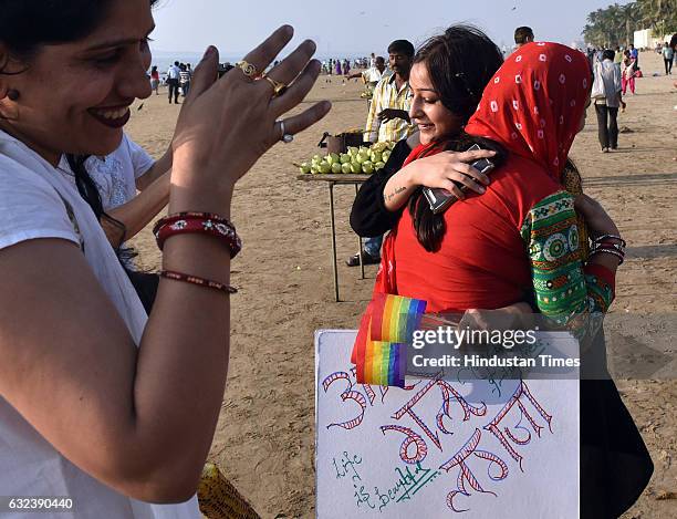 Member of LGBT community interacts with youngsters on Juhu beach during Queer Azadi Free Hugs Moment where the members of the LGBT community...