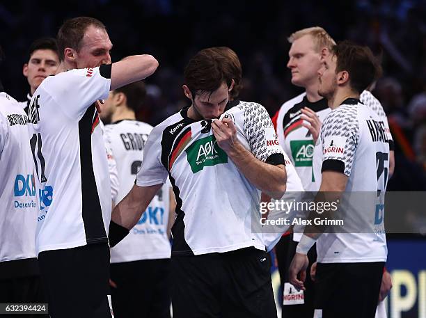 Holger Glandorf and Uwe Gensheimer of Germany look dejected after the 25th IHF Men's World Championship 2017 Round of 16 match between Germany and...