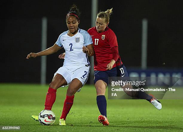 Kristine Minde of Norway competes for the ball with Alex Scott of England during the international friendly match between Norway Women and England...
