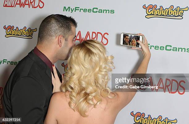Adult film director Alan E of Stills by Alan and adult film actress Samantha Rone take a selfie as they attend the 2017 Adult Video News Awards at...