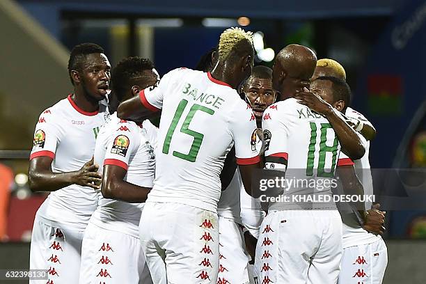 Burkina Faso's players celebrate a goal during the 2017 Africa Cup of Nations group A football match between Guinea-Bissau and Burkina Faso in...