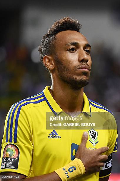 Gabon's forward Pierre-Emerick Aubameyang listens to the national anthems ahead of the 2017 Africa Cup of Nations group A football match between...