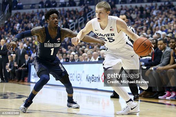 Macura of the Xavier Musketeers drives to the basket past Tre Campbell of the Georgetown Hoyas during the first half at Cintas Center on January 22,...
