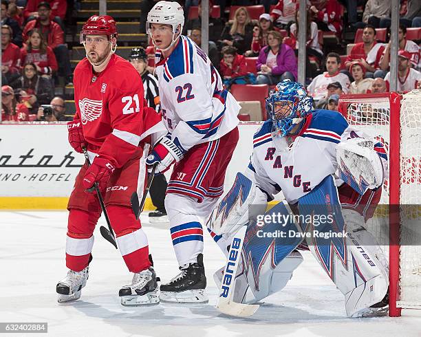 Tomas Tatar of the Detroit Red Wings looks for a pass in front of Nick Holden and goaltender Henrik Lundqvist of the New York Rangers during an NHL...