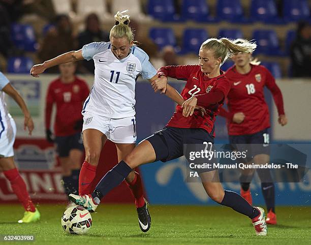 Anja Sonstevold of Norway competes for the ball with Toni Duggan of England during the international friendly match between Norway Women and England...