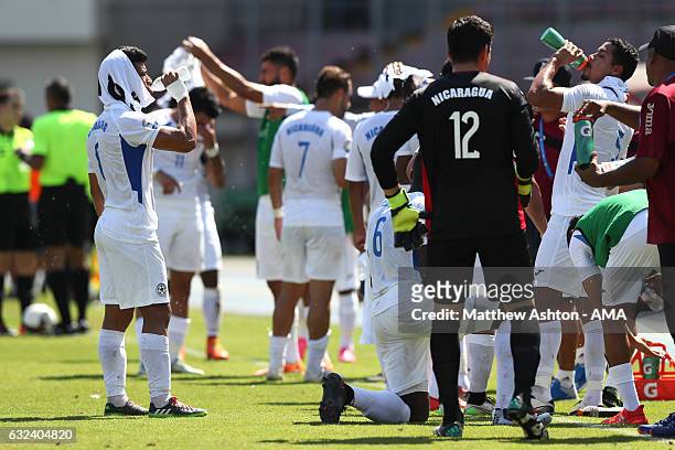 The Nicaragua payers take a drinks break during the Copa Centroamericana match between El Salvador and Nicaragua at Estadio Rommel Fernandez on...