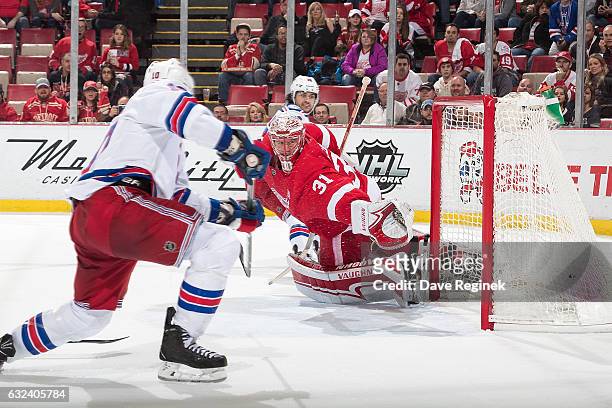 Miller of the New York Rangers scores an overtime goal on Jared Coreau of the Detroit Red Wings during of an NHL game at Joe Louis Arena on January...