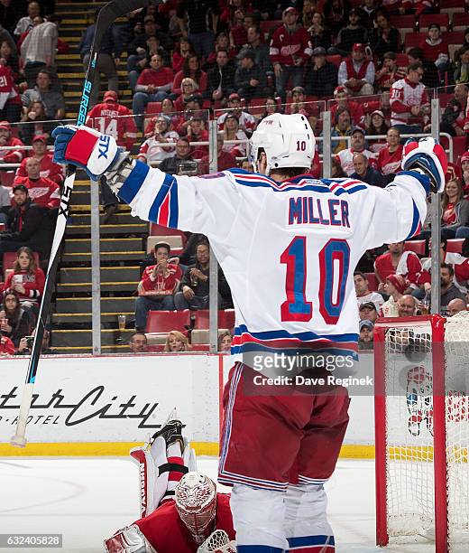 Miller of the New York Rangers celebrates his overtime goal in front of goaltender Jared Coreau of the Detroit Red Wings during an NHL game at Joe...