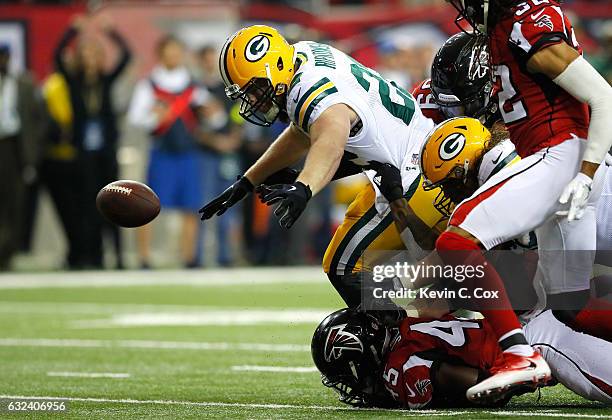Aaron Ripkowski of the Green Bay Packers fumbles in the second quarter against the Atlanta Falcons in the NFC Championship Game at the Georgia Dome...