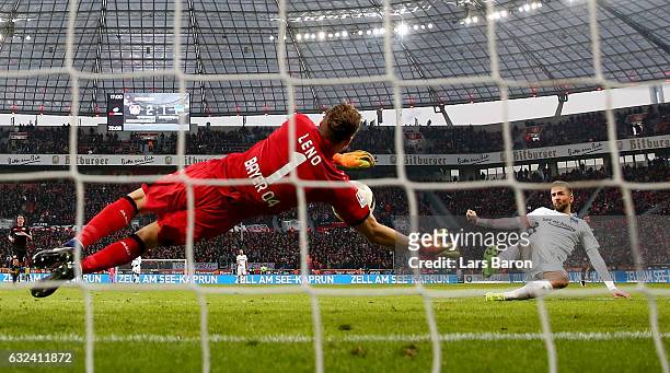 Bernd Leno of Bayer Leverkusen saves a shot of Vedad Ibisevic of Berlin during the Bundesliga match between Bayer 04 Leverkusen and Hertha BSC at...