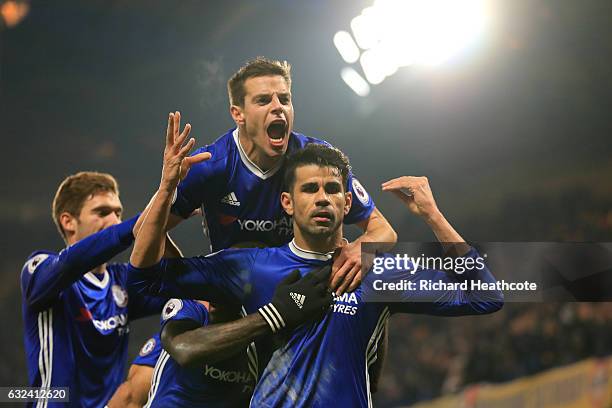 Diego Costa of Chelsea celebrates scoring the opening goal with his team mates during the Premier League match between Chelsea and Hull City at...