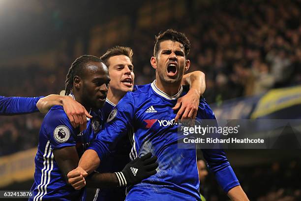 Diego Costa of Chelsea celebrates scoring the opening goal with his team mates during the Premier League match between Chelsea and Hull City at...