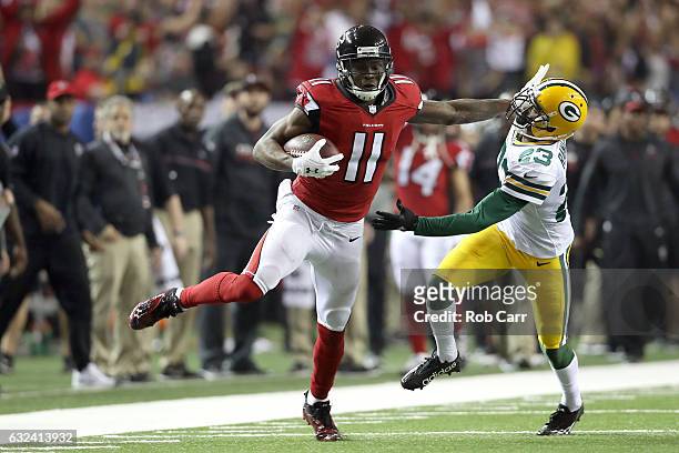 Julio Jones of the Atlanta Falcons runs after a catch for a 73 yard touchdown against Damarious Randall of the Green Bay Packers in the third quarter...